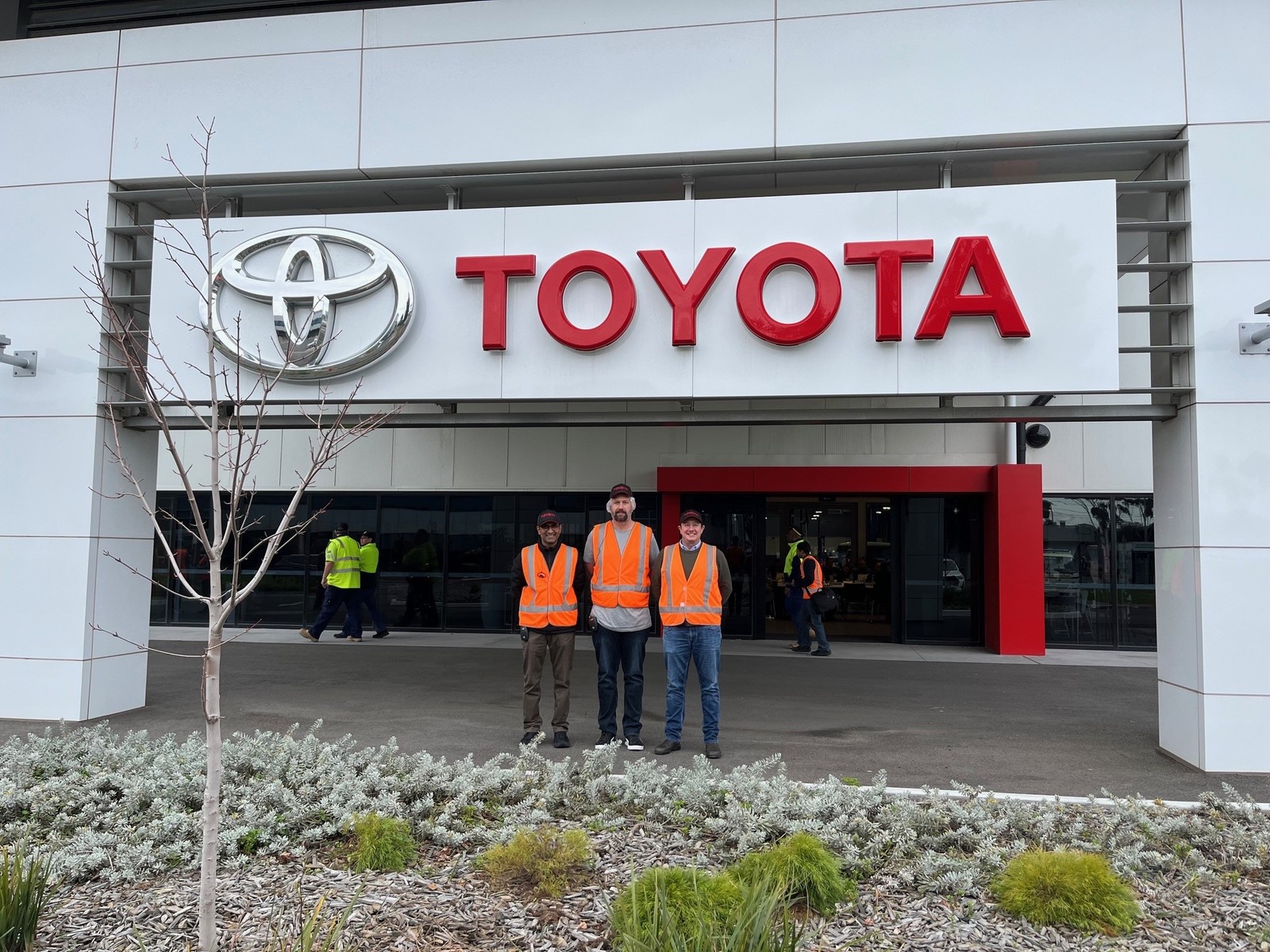 Scope employees standing in front of Toyota