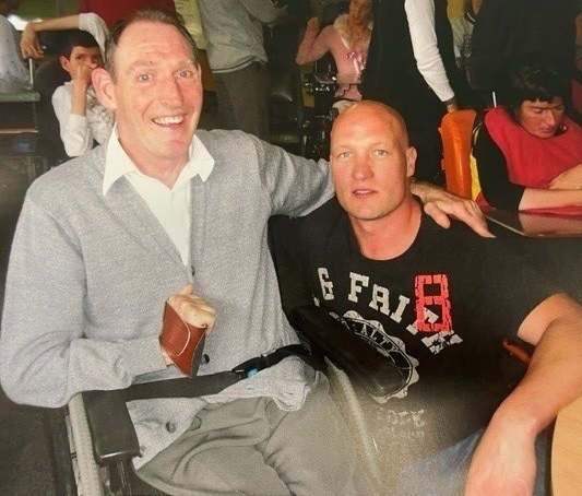2 men are looking at the camera