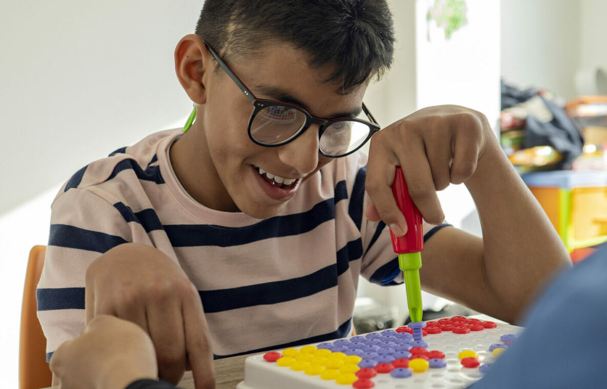 Young boy completing an activity.