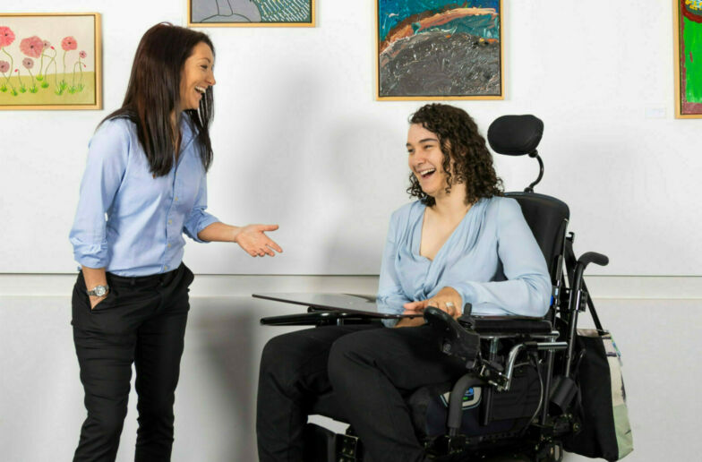 Two female work colleagues having a chat.