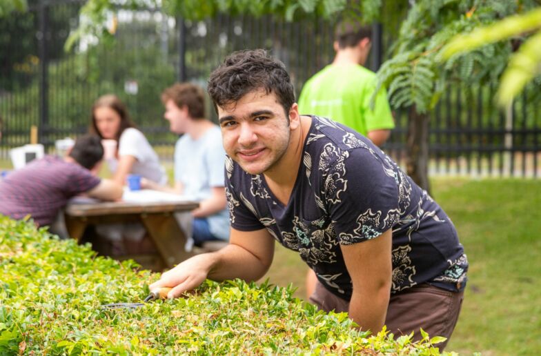 A boy is doing gardening