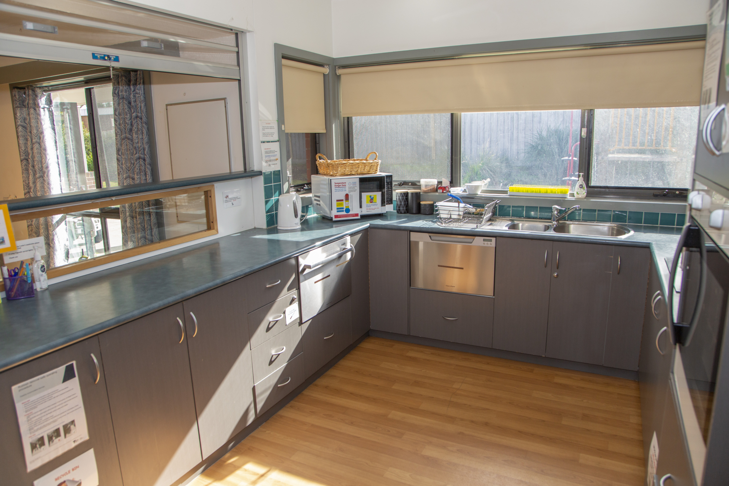 Kitchen area with grey cabinets