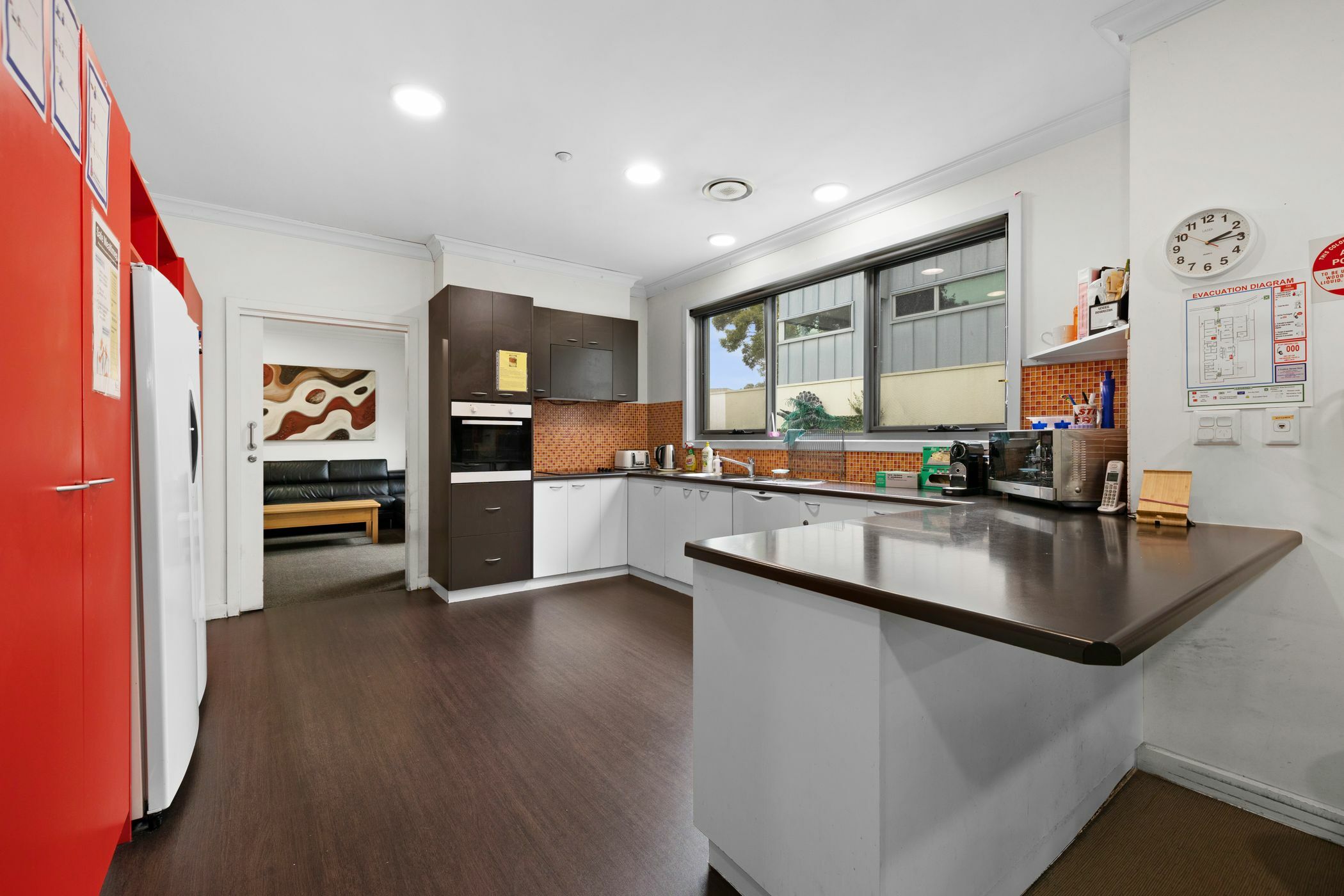 Kitchen area with brown stone benchtop