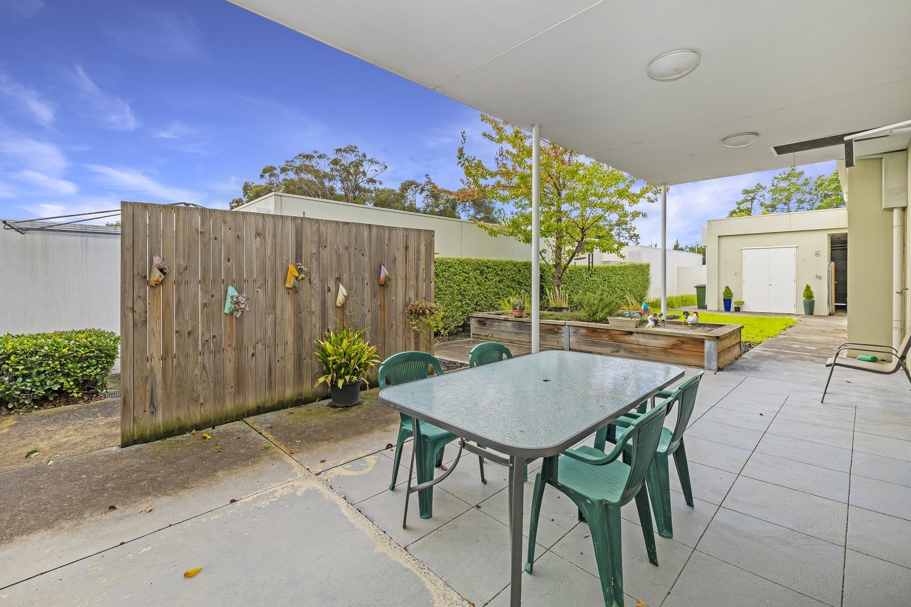 Courtyard in a Kew SDA home with outdoor table and chairs