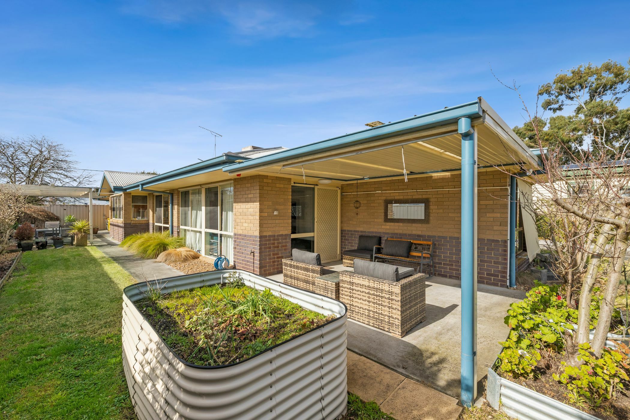 Backyard area with raised garden beds