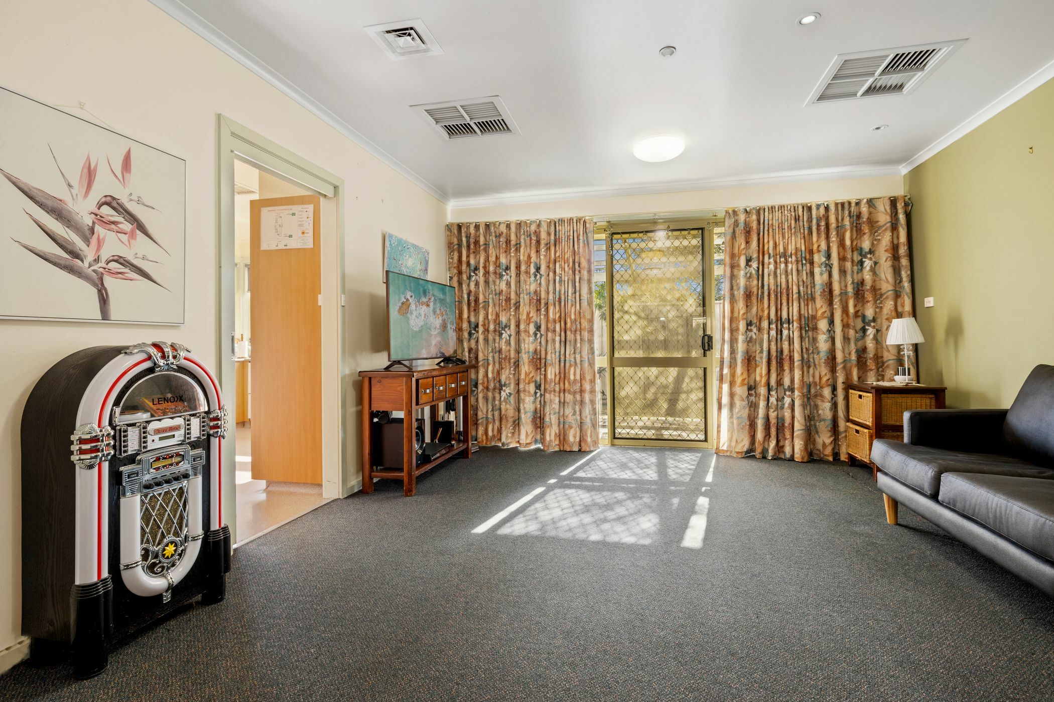 Living area with large window and jukebox