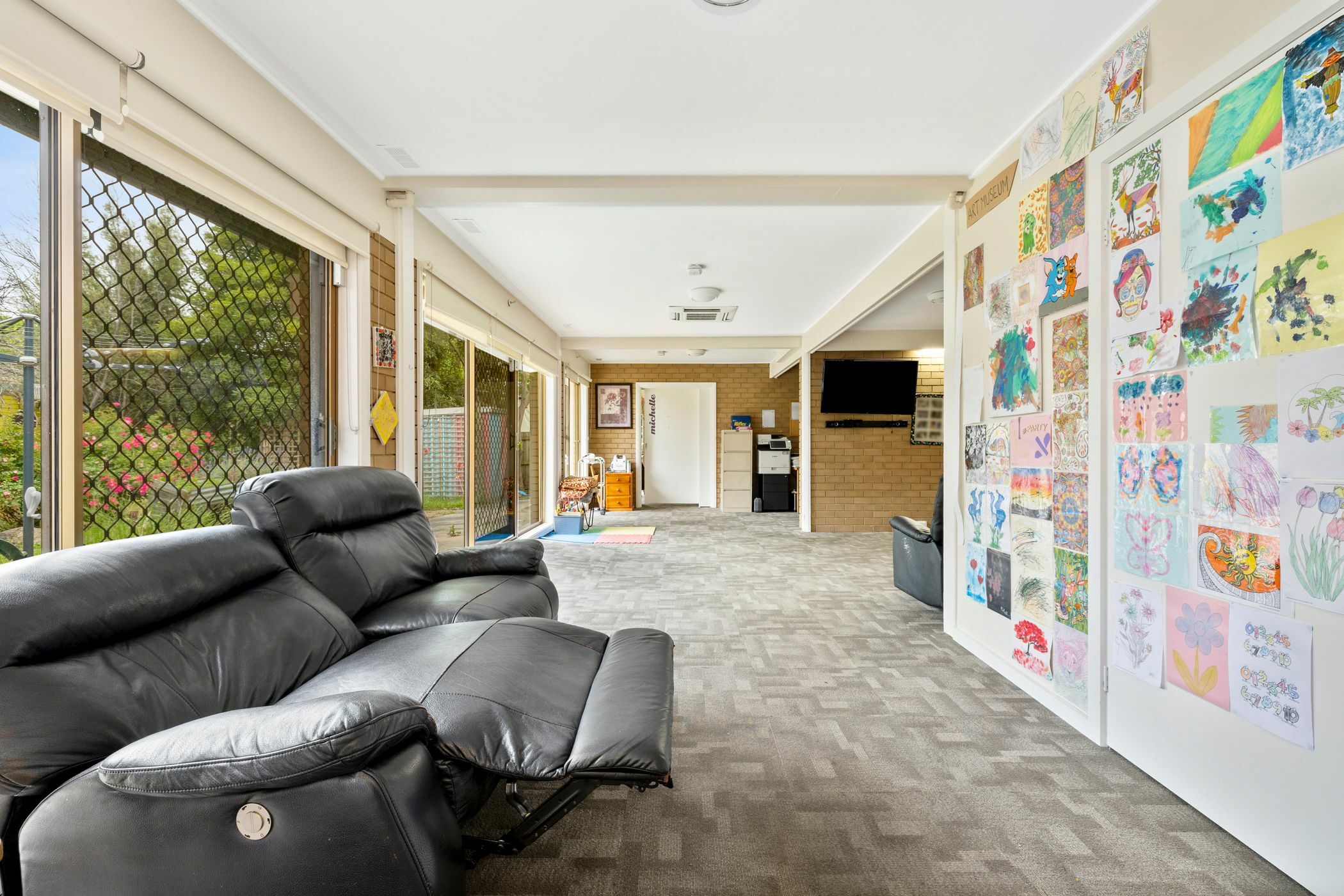 Living area with artwork on wall