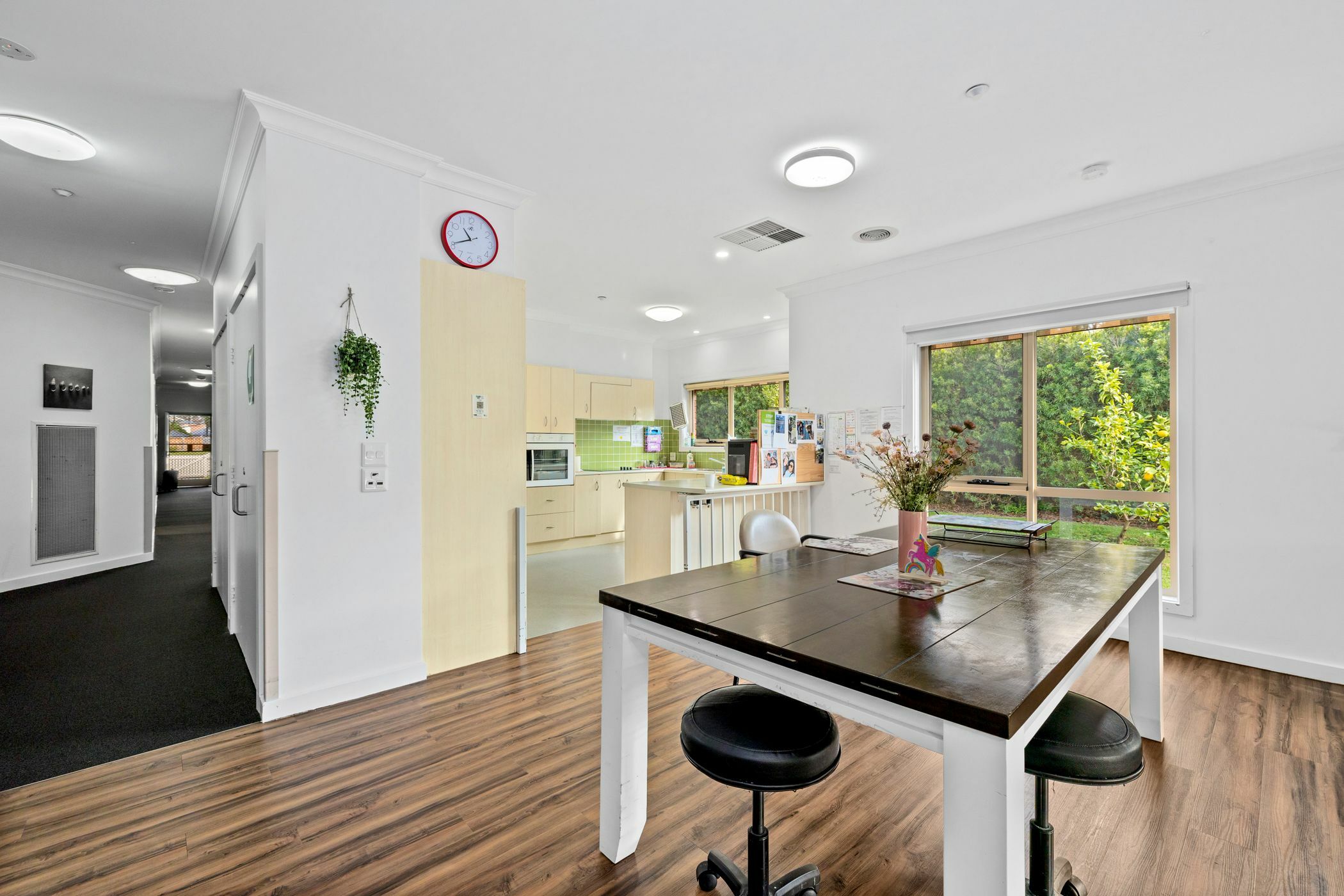 Dining area with wooden floorboards and wooden bench top table