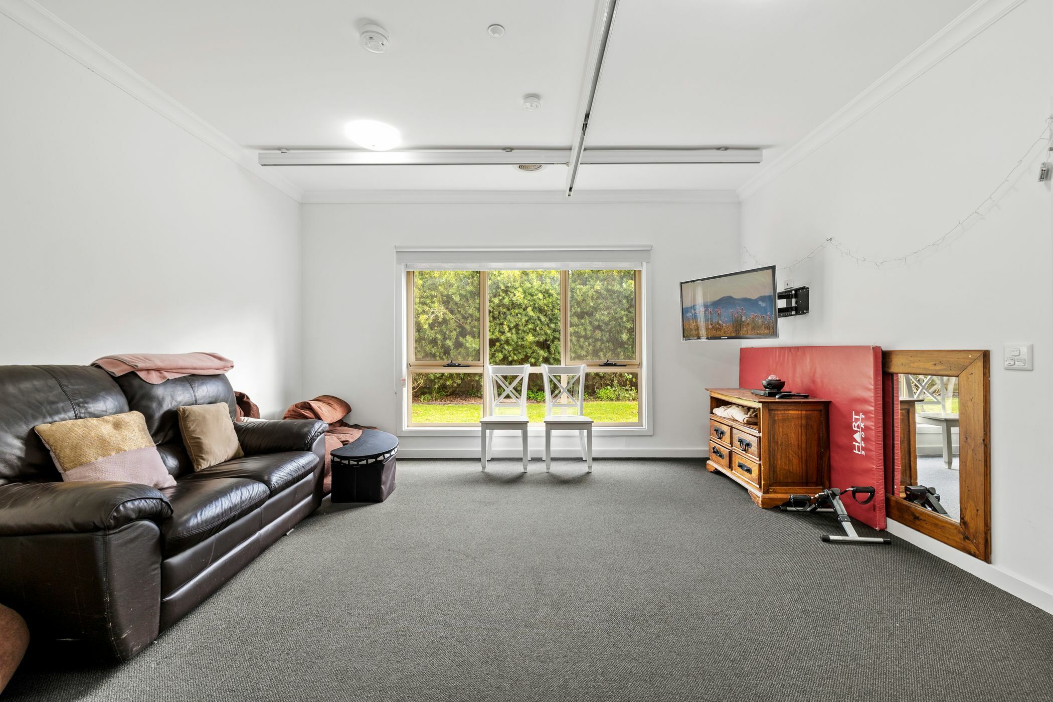 Living room with large window looking out to backyard